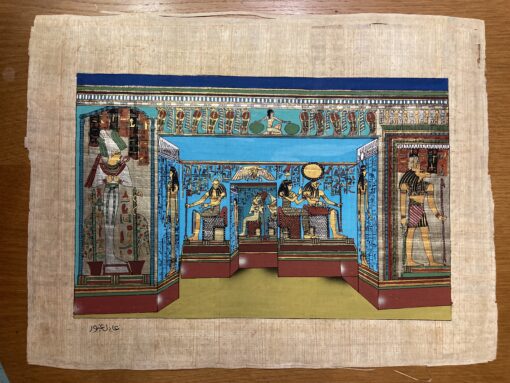 Hand-painted Egyptian papyrus artwork showing the Temple of Queen Nefertari at Abu Simbel with detailed statues and hieroglyphs.