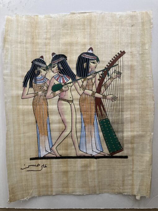 Hand-painted Egyptian papyrus artwork showing ancient dancers and musicians in traditional attire, celebrating music and culture in ancient Egypt.