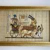Hand-painted Egyptian papyrus painting of Ramses II riding a war chariot, framed artwork from Egyptian Art Caravan